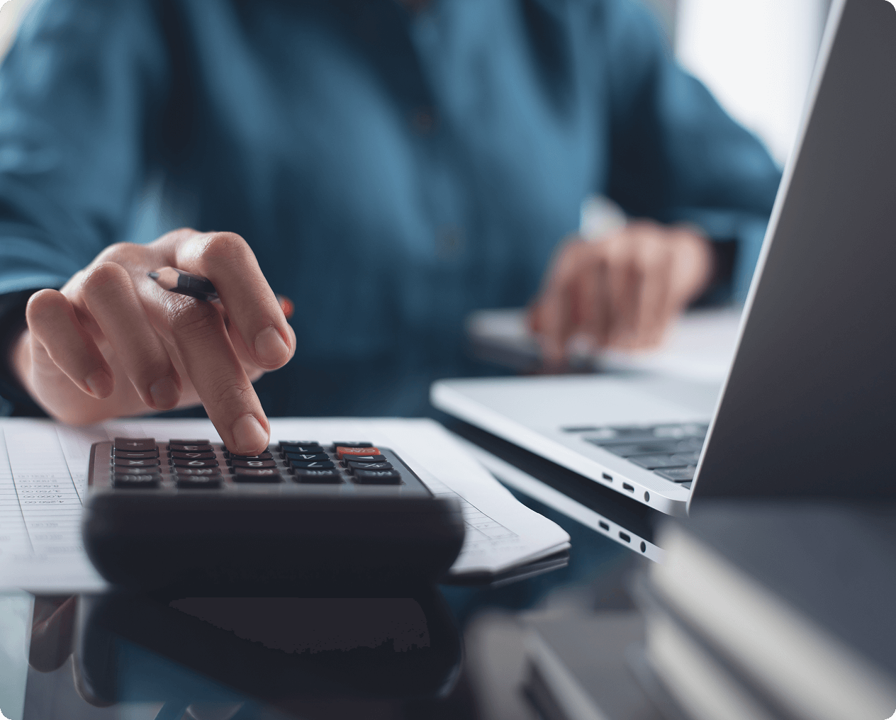 Office work with calculator and laptop